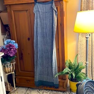 60” x 44”. Use it as a scarf, as a throw, or as a lightweight beach, blanket.